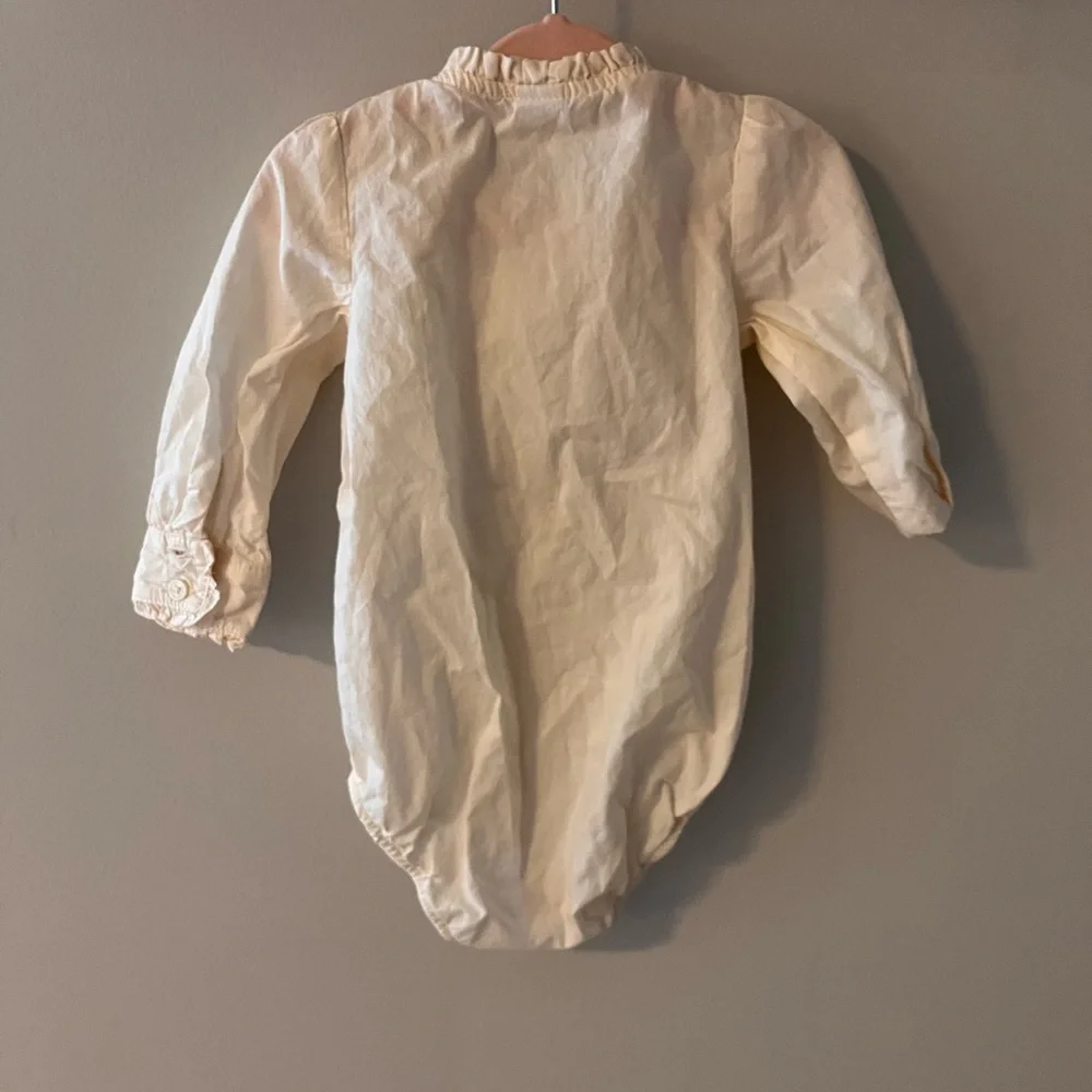 Cream ruffle button up top